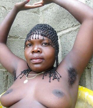Insane African prostitute posing on